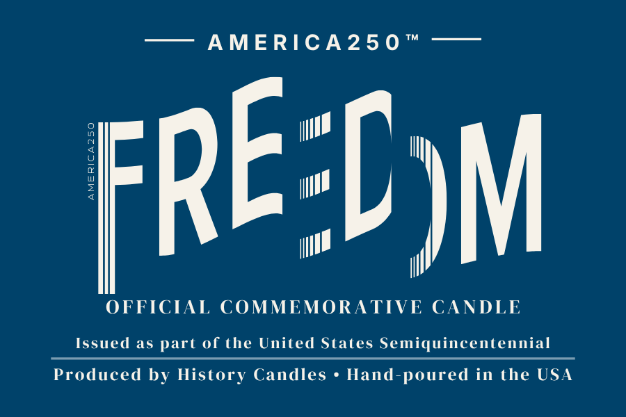 Blue and white product label for the America250 Freedom commemorative candle, featuring large stylized white lettering and text about the official commemorative candle and production details.