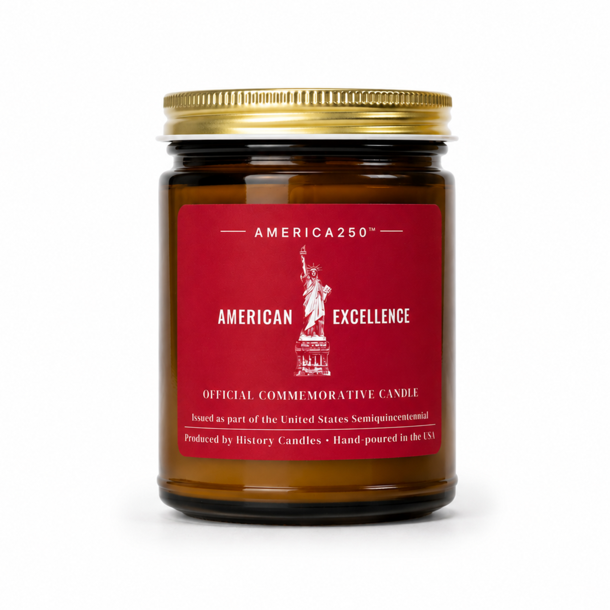An amber glass jar candle with a gold metal lid and a red label featuring the Statue of Liberty and the text 'AMERICA250' and 'AMERICAN EXCELLENCE'.