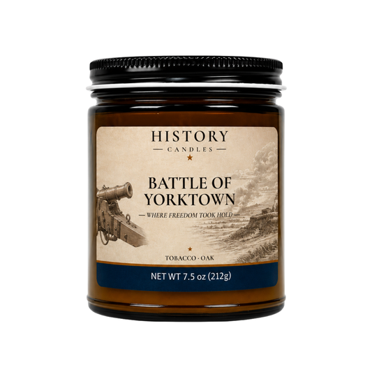 Battle of Yorktown candle with Tobacco & Oak fragrance in an amber glass jar with a black metal lid.