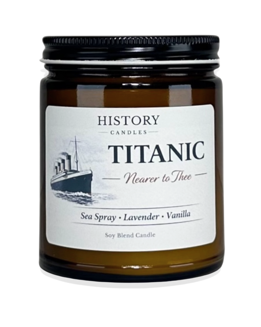 Titanic soy candle in amber glass jar with black lid on white background