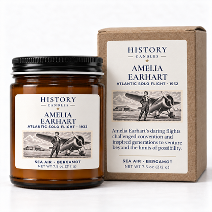 Amelia Earhart candle beside its matching kraft gift box with historical aviation artwork.