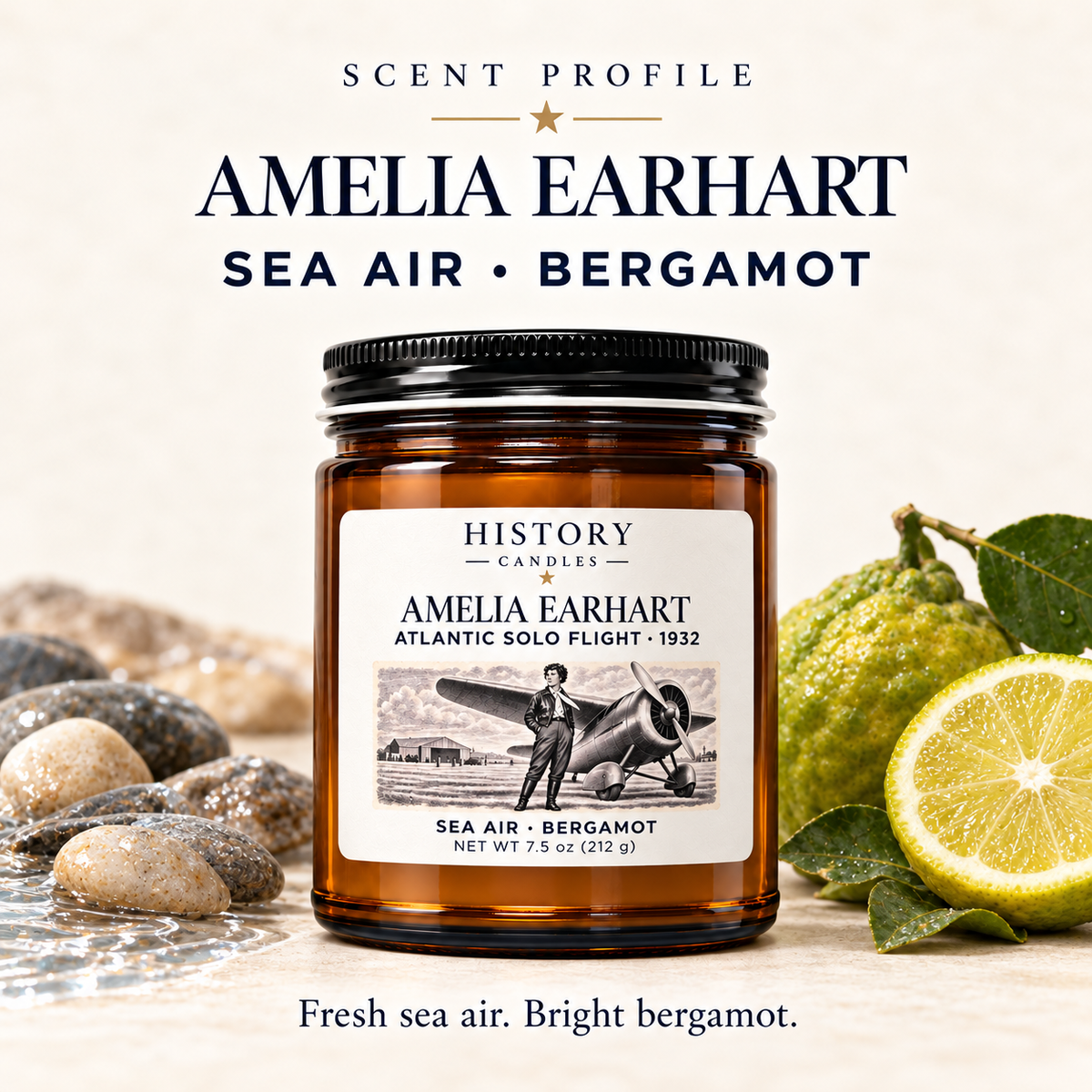 Amelia Earhart scent profile: fresh sea air and bright bergamot, illustrated with coastal stones and bergamot beside the candle.