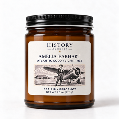 Amelia Earhart Sea Air · Bergamot candle in an amber glass jar with a black lid and artwork commemorating her 1932 Atlantic solo flight.