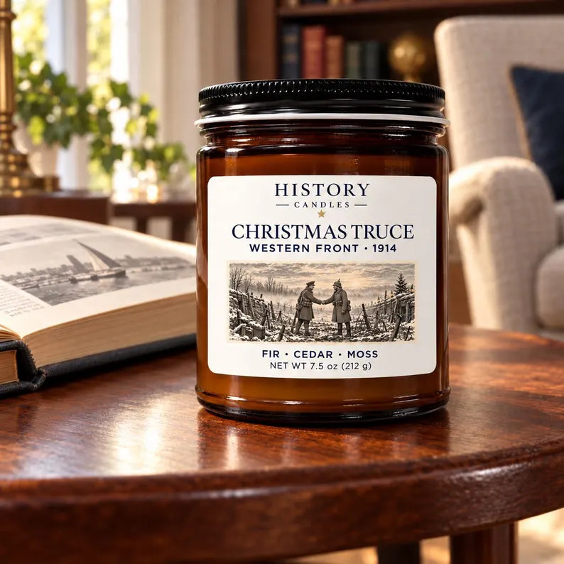 Christmas Truce candle displayed on a wooden table in a warm study.